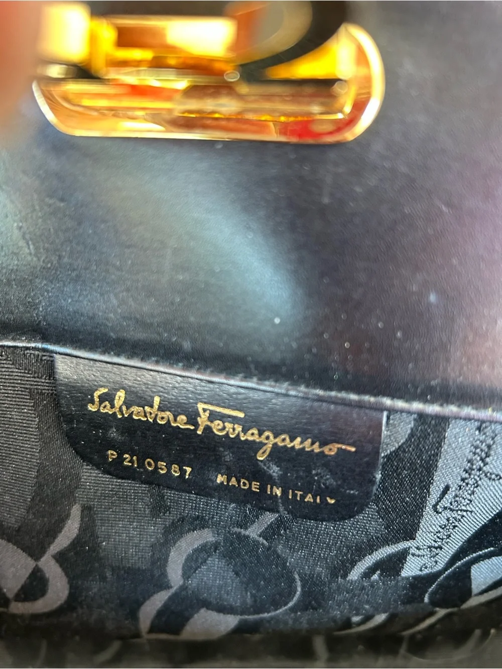 Salvatore Ferragamo Black Leather Clutch with Gold Ring Detail